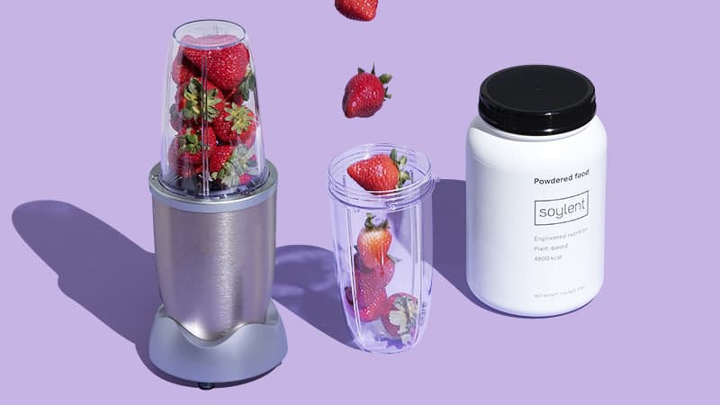 Mixer canister filling with falling strawberries between a mixer filled with strawberries and a Soylent Powder Tub.